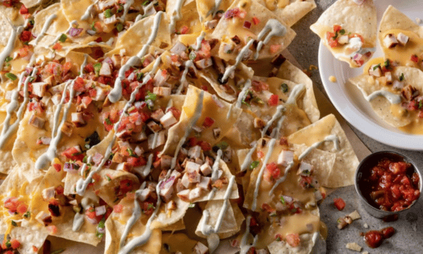 Loaded nachos with cheese, sour cream and salsa